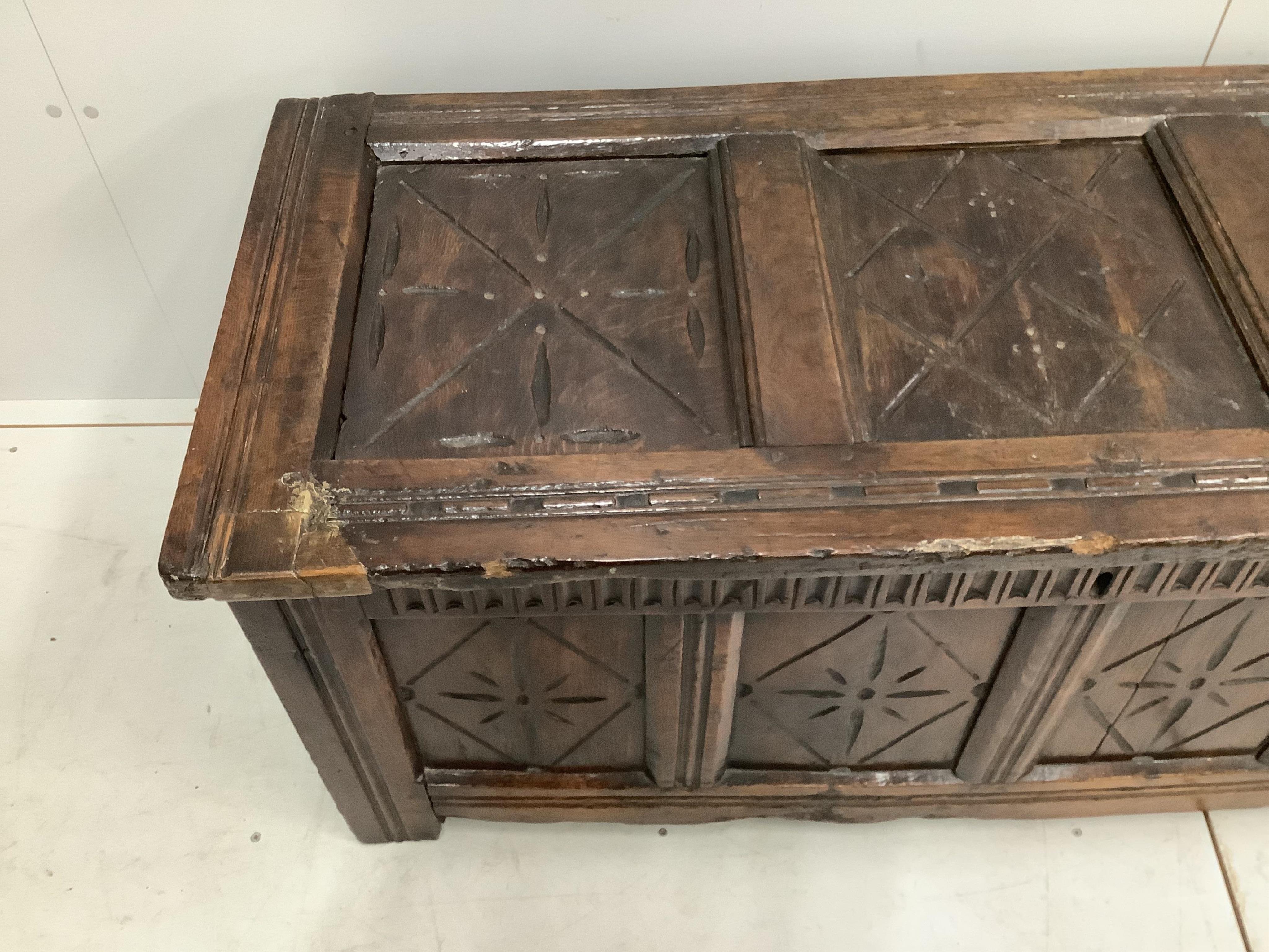 An early 18th century and later oak coffer, width 132cm, height 58cm. Condition - poor